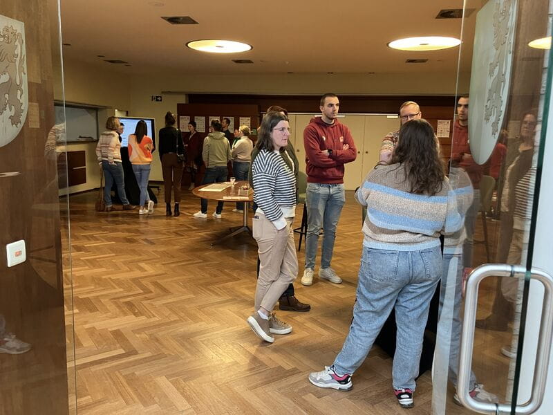 Participants talking in small groups during the Empathy Lab in De Panne